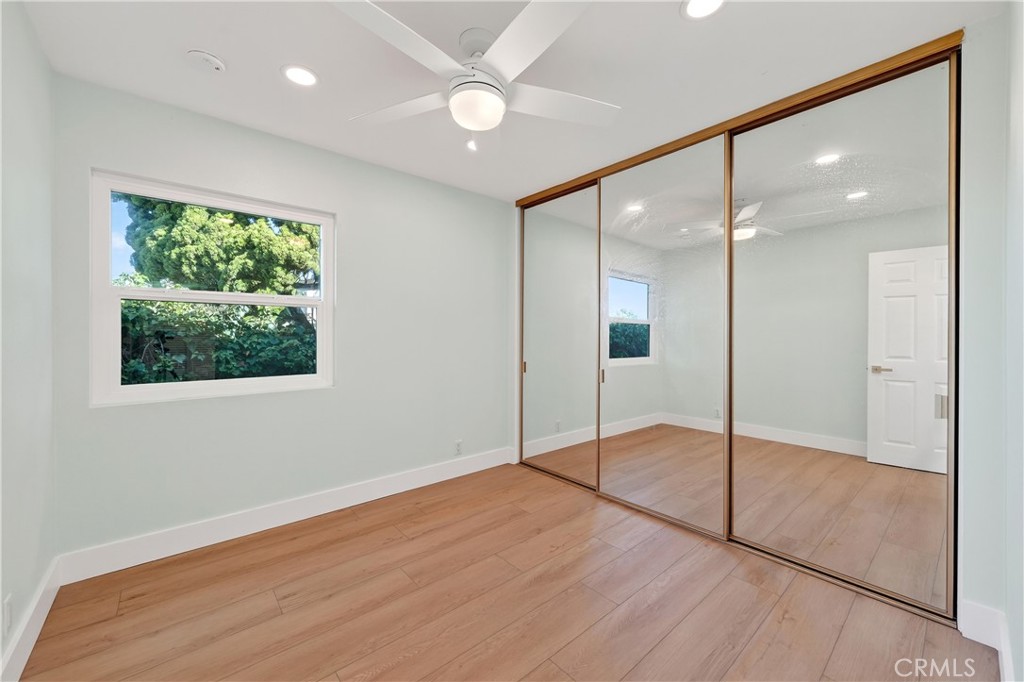 34381 Dana Strand Road, Unit 2 Dana Point, CA 92629 - Photo 27 of 42 a view of an empty room with wooden floor and a window