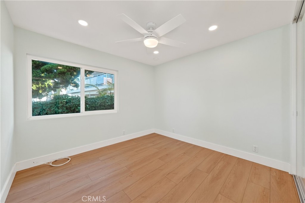 34381 Dana Strand Road, Unit 2 Dana Point, CA 92629 - Photo 28 of 42 a view of a big room with wooden floor and windows