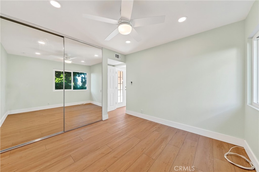 34381 Dana Strand Road, Unit 2 Dana Point, CA 92629 - Photo 29 of 42 wooden floor in an empty room with a window