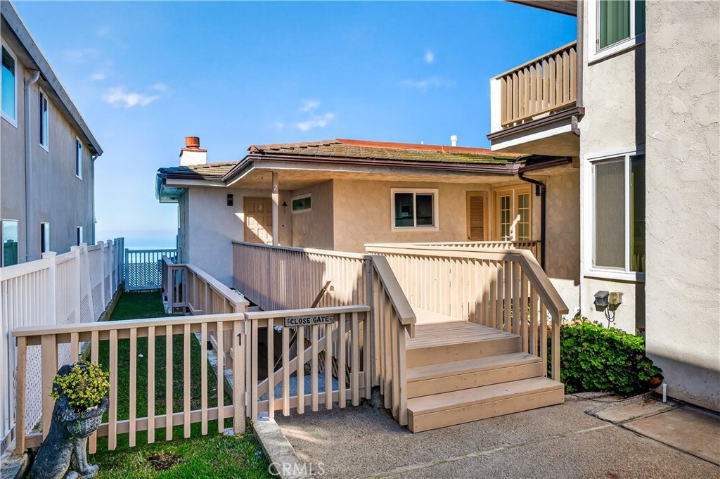 34381 Dana Strand Road, Unit 2 Dana Point, CA 92629 - Photo 35 of 42 a view of a house with a small yard