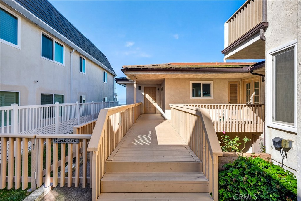 34381 Dana Strand Road, Unit 2 Dana Point, CA 92629 - Photo 36 of 42 a view of a house with wooden fence