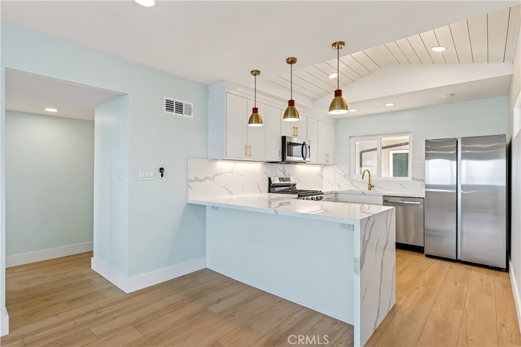 34381 Dana Strand Road, Unit 2 Dana Point, CA 92629 - Photo 7 of 42 a kitchen with a sink a refrigerator and window