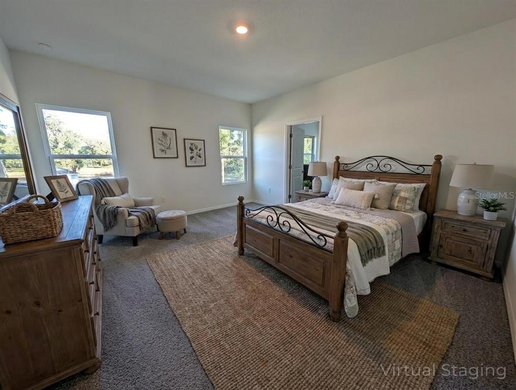5173 Southwest 52nd Drive Gainesville, FL 32608 - Photo 5 of 14 a spacious bedroom with a bed couch and a window
