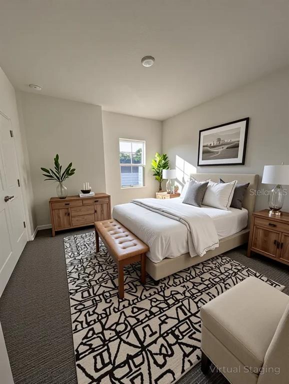 5173 Southwest 52nd Drive Gainesville, FL 32608 - Photo 6 of 14 a bedroom with a bed and wooden floor