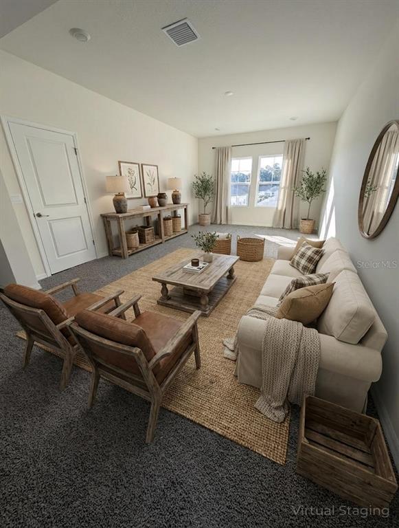 5173 Southwest 52nd Drive Gainesville, FL 32608 - Photo 7 of 14 a living room with furniture a large window and a table