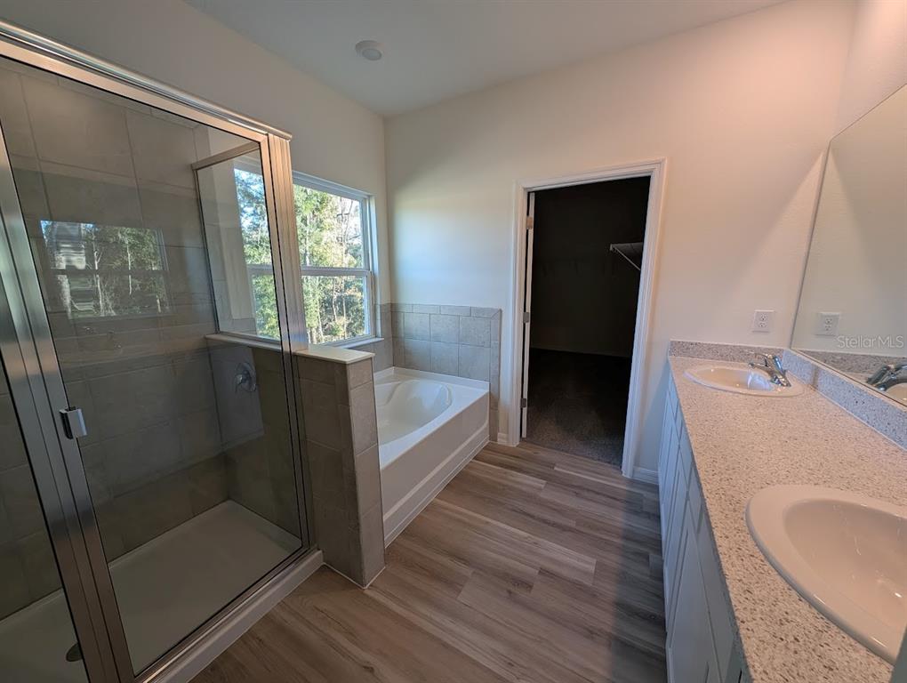 5173 Southwest 52nd Drive Gainesville, FL 32608 - Photo 8 of 14 a bathroom with a sink and shower