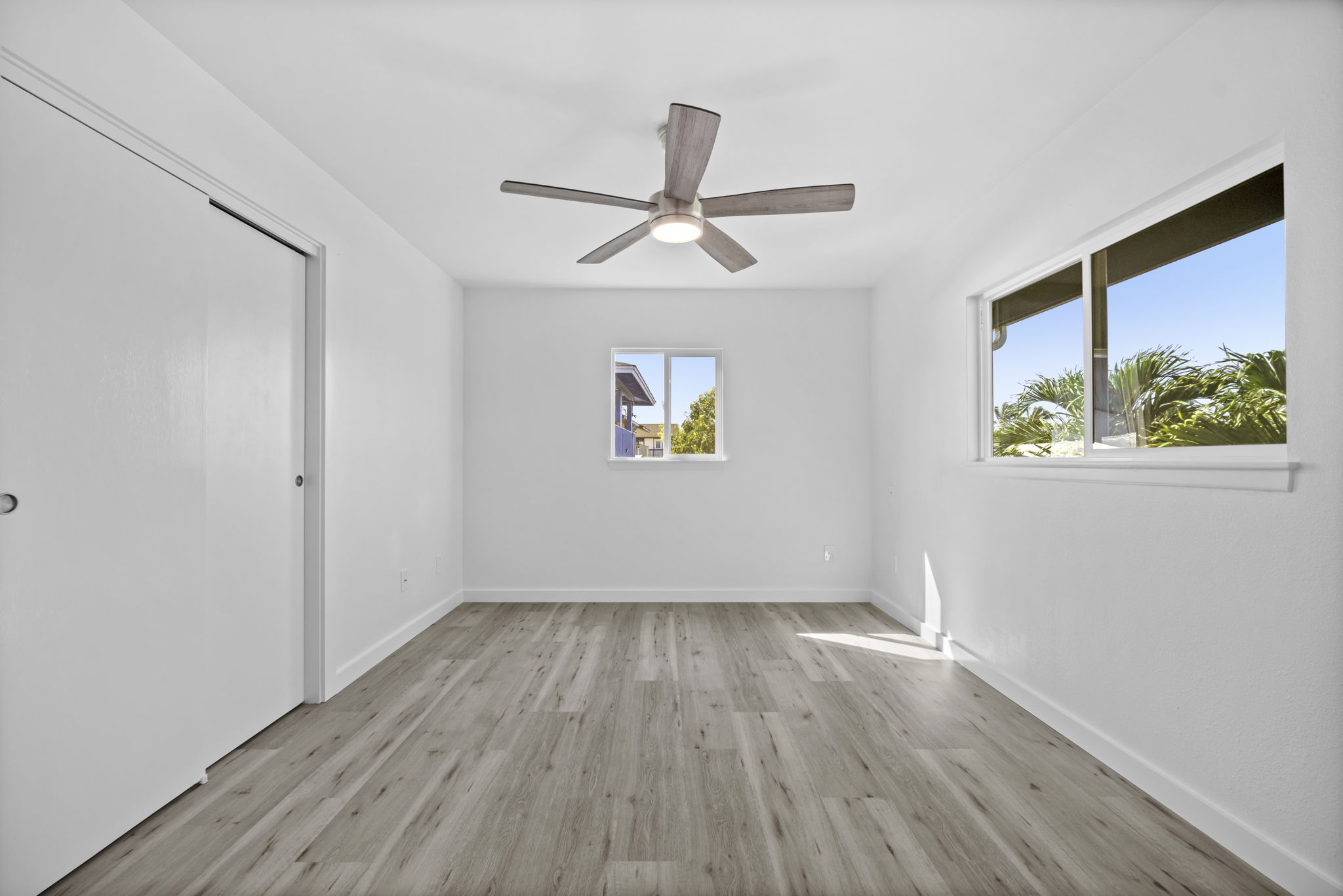 4431 Iona Road Hanapepe, HI 96705 - Photo 16 of 20 wooden floor in an empty room with a window