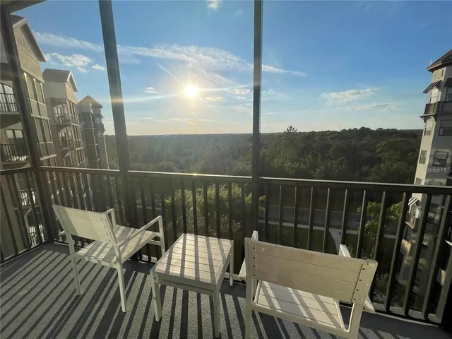 a view of a balcony with wooden floor