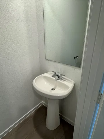 a bathroom with a sink a mirror and a toilet