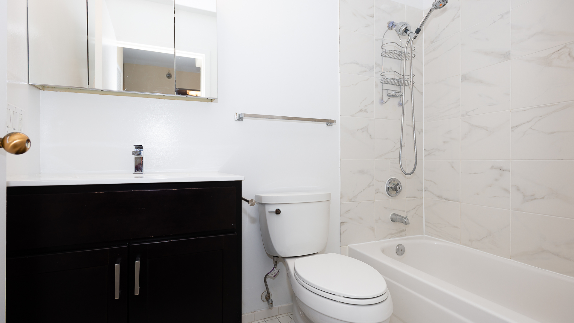 111 West Maple Street, Unit 1110 Chicago, IL 60610 - Photo 16 of 23 a bathroom with a toilet a sink and bathtub