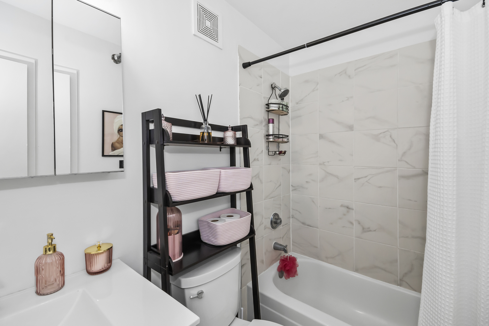 111 West Maple Street, Unit 1110 Chicago, IL 60610 - Photo 17 of 23 a bathroom with a sink toilet and shower