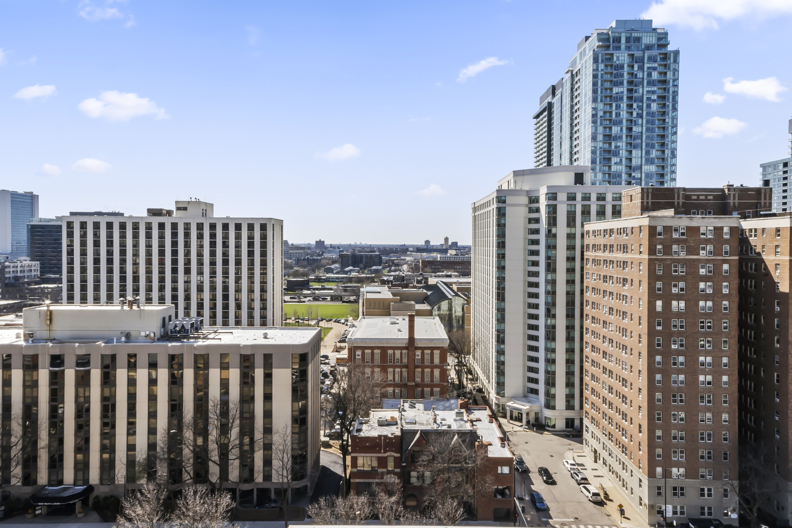 111 West Maple Street, Unit 1110 Chicago, IL 60610 - Photo 6 of 23 a view of a city with tall buildings