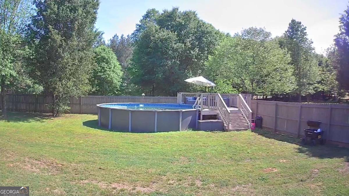 457 Old Good Hope Road Good Hope, GA 30641 - Photo 52 of 59 a view of a backyard with swimming pool
