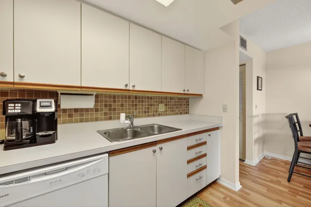 a kitchen with a sink and cabinets