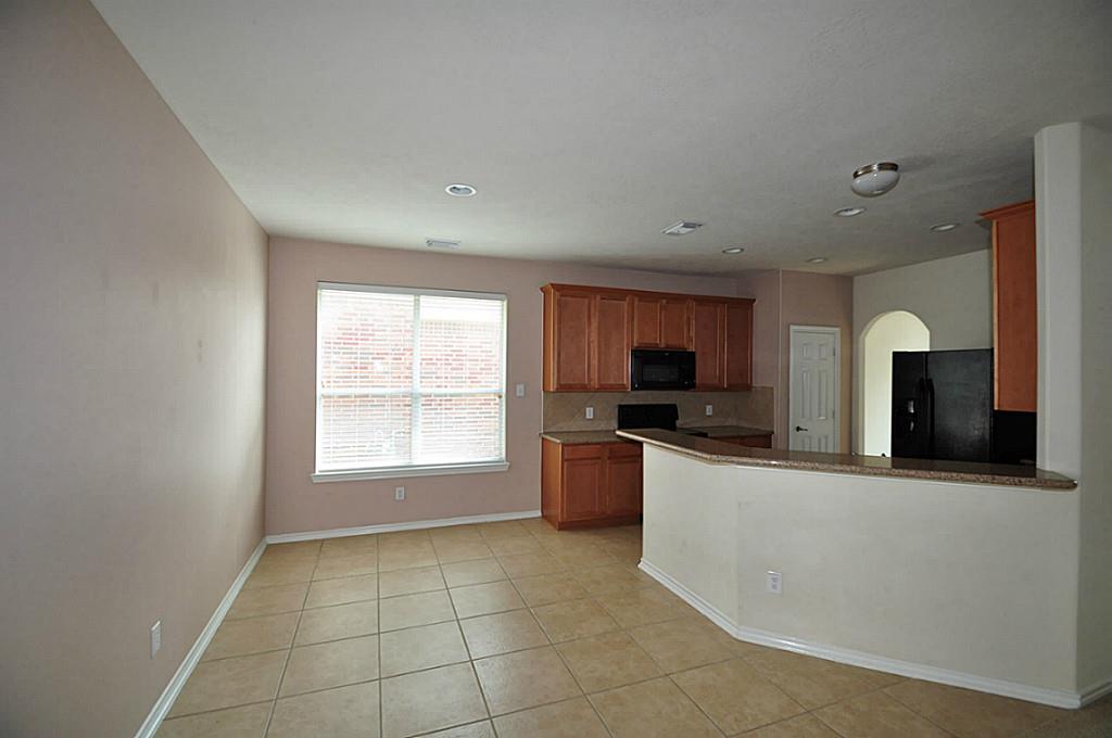 12315 Field Brook Court Houston, TX 77089 - Photo 12 of 28 a large kitchen with a large counter top and stainless steel appliances