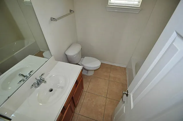 a bathroom with a toilet and a sink
