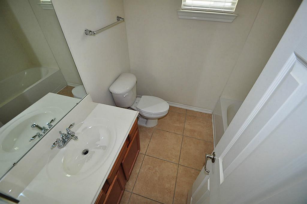 12315 Field Brook Court Houston, TX 77089 - Photo 14 of 28 a bathroom with a toilet and a sink