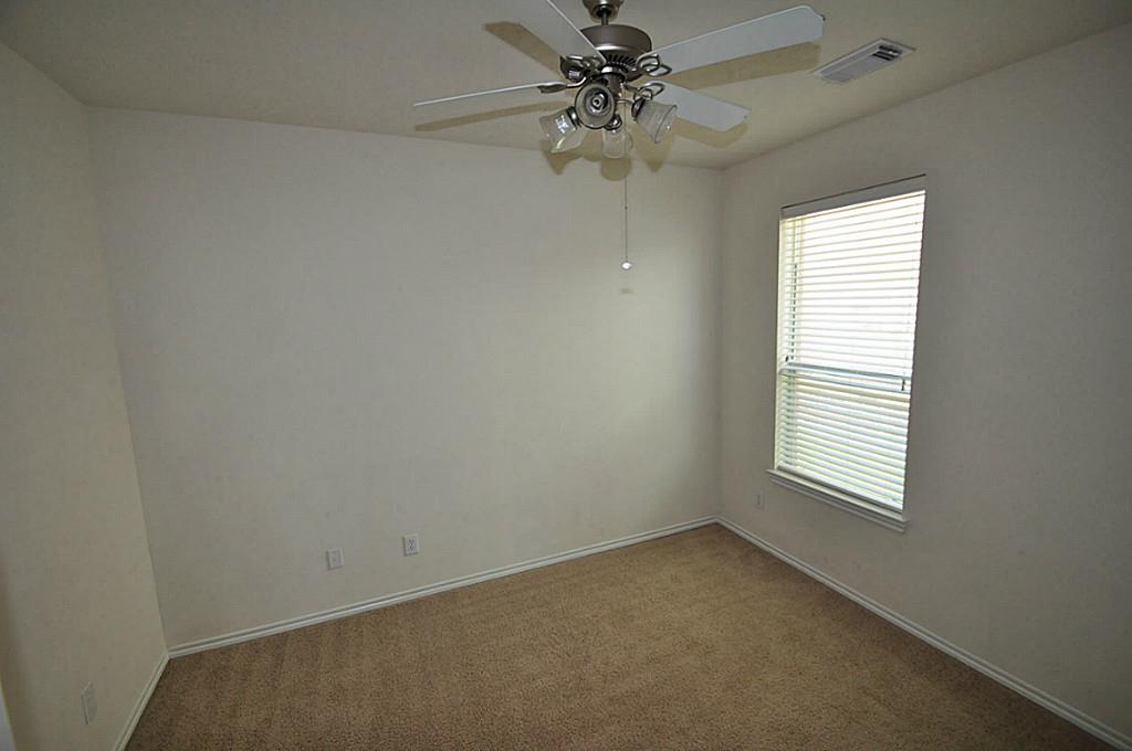 12315 Field Brook Court Houston, TX 77089 - Photo 18 of 28 an empty room with windows and fan