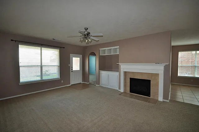 a view of empty room with fireplace