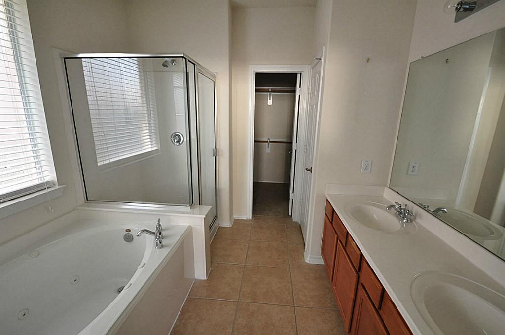 12315 Field Brook Court Houston, TX 77089 - Photo 5 of 28 a bathroom with a tub sink and mirror
