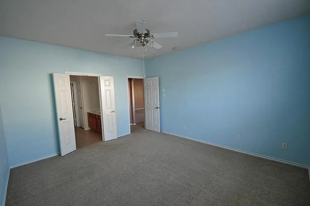 an empty room with a bathroom