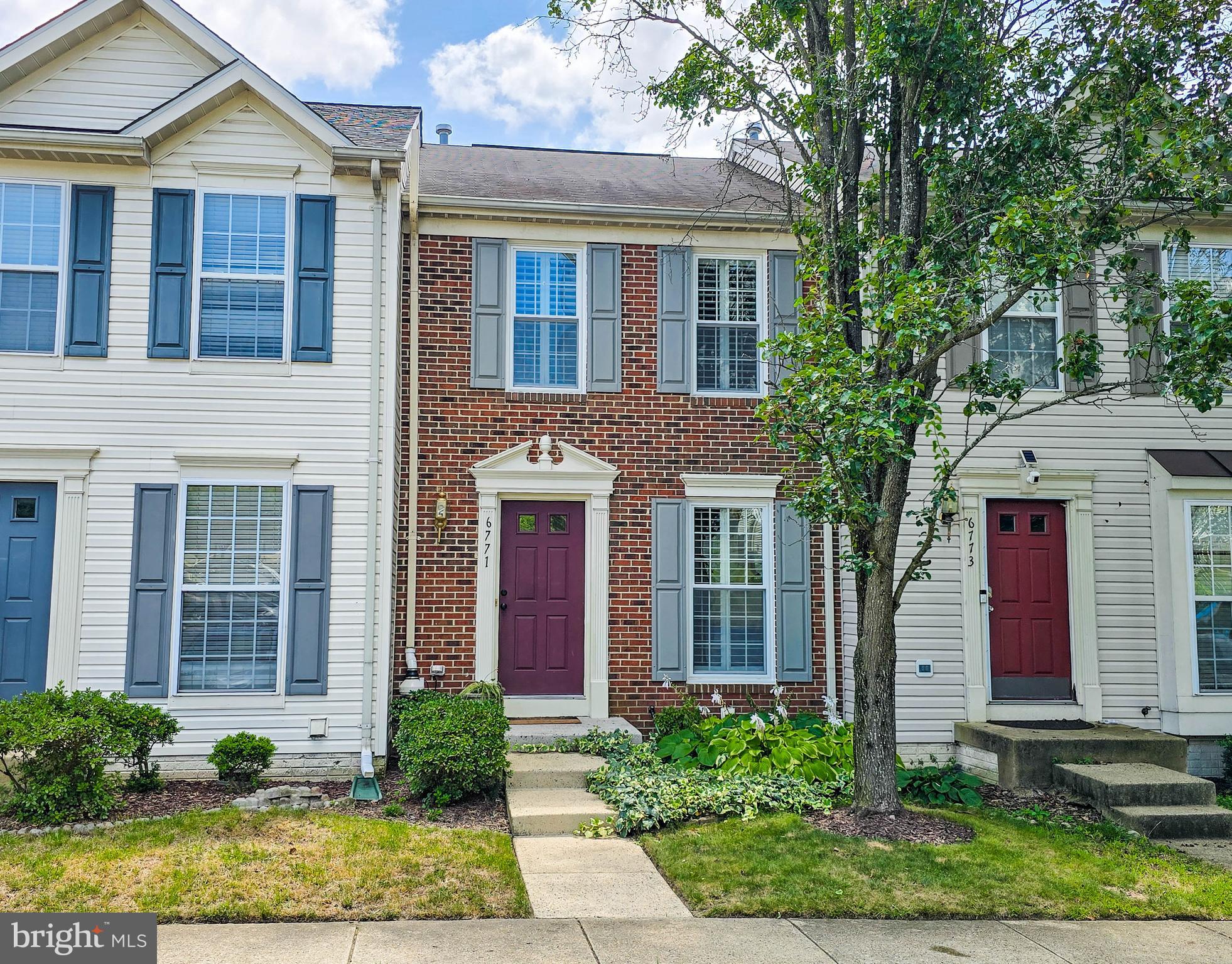 6771 Stone Maple Terrace Centreville, VA 20121 - Photo 1 of 33 a front view of a house with garden