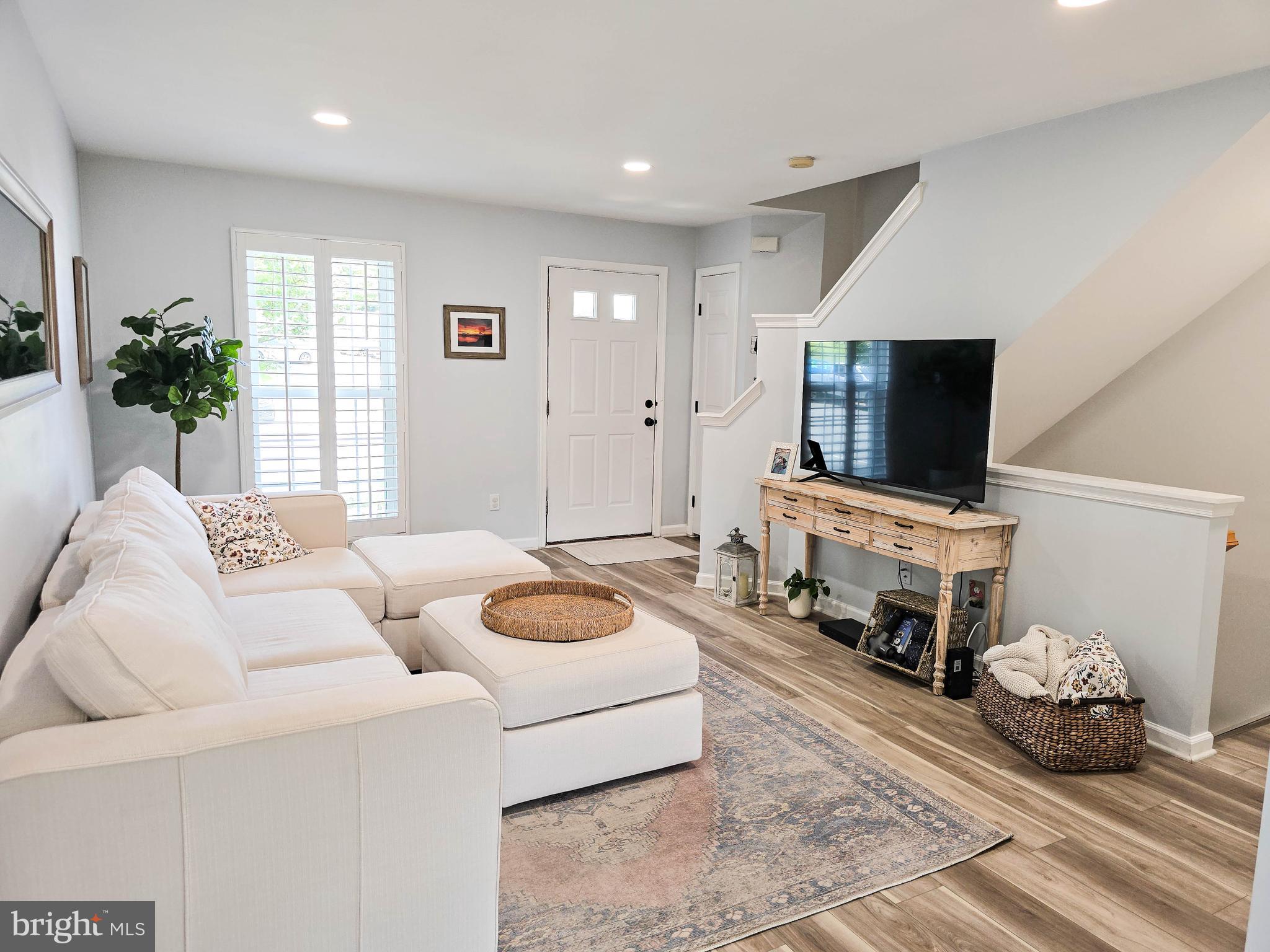 6771 Stone Maple Terrace Centreville, VA 20121 - Photo 11 of 33 a living room with furniture and a flat screen tv