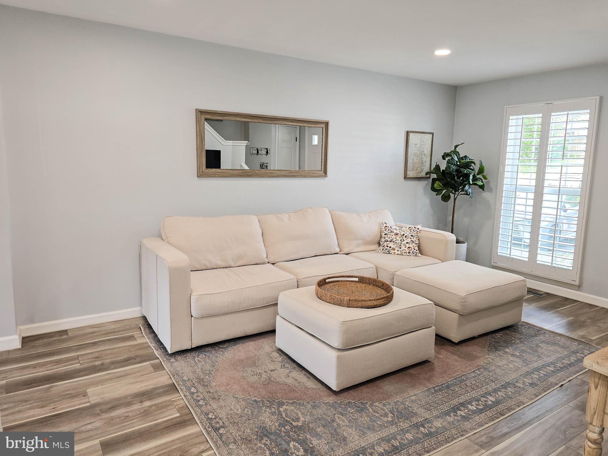 6771 Stone Maple Terrace Centreville, VA 20121 - Photo 12 of 33 a living room with furniture and a couch