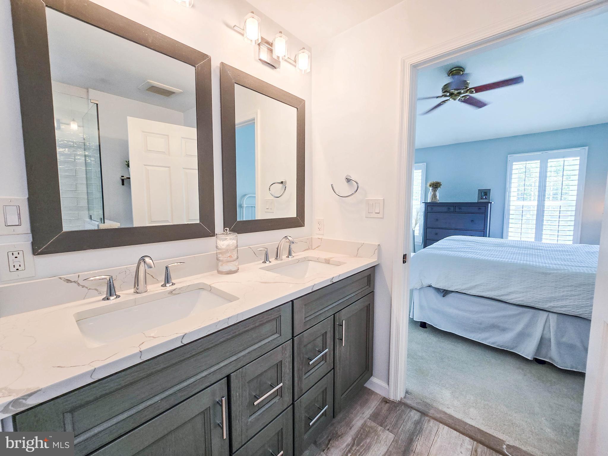 6771 Stone Maple Terrace Centreville, VA 20121 - Photo 17 of 33 a bathroom with a double vanity sink and mirror