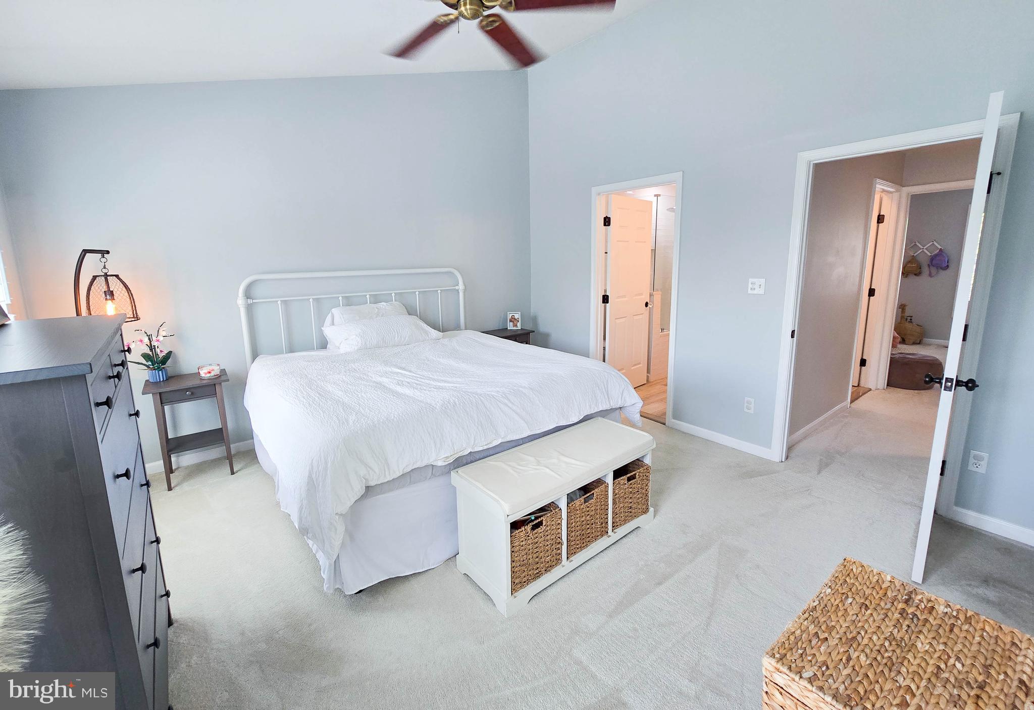 6771 Stone Maple Terrace Centreville, VA 20121 - Photo 19 of 33 a spacious bedroom with a bed and a couch