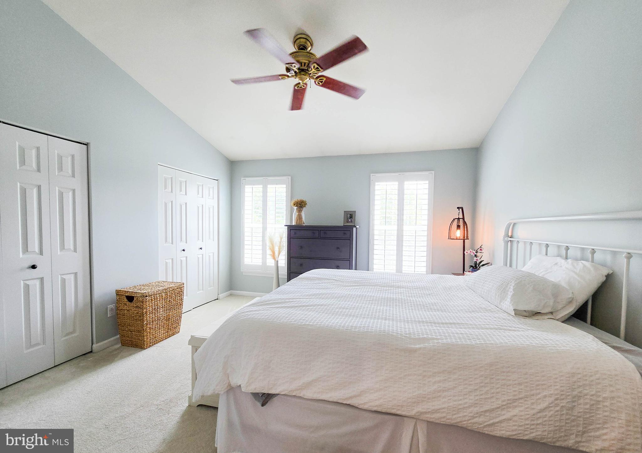 6771 Stone Maple Terrace Centreville, VA 20121 - Photo 20 of 33 a bedroom with a bed and a chandelier