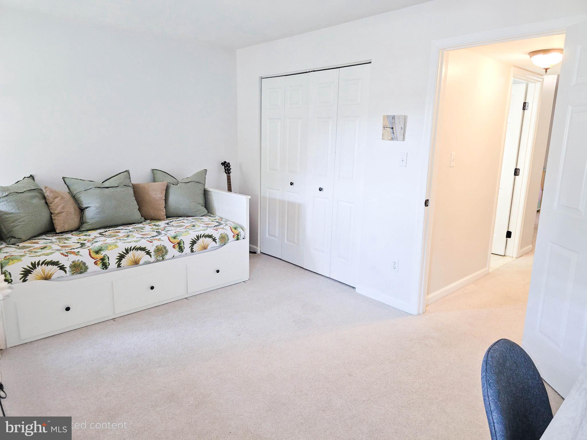 6771 Stone Maple Terrace Centreville, VA 20121 - Photo 25 of 33 a living room with furniture and a chair