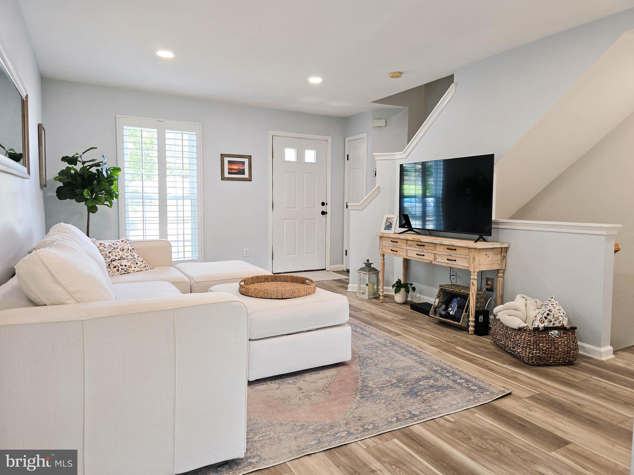 6771 Stone Maple Terrace Centreville, VA 20121 - Photo 10 of 33 a living room with furniture and a flat screen tv
