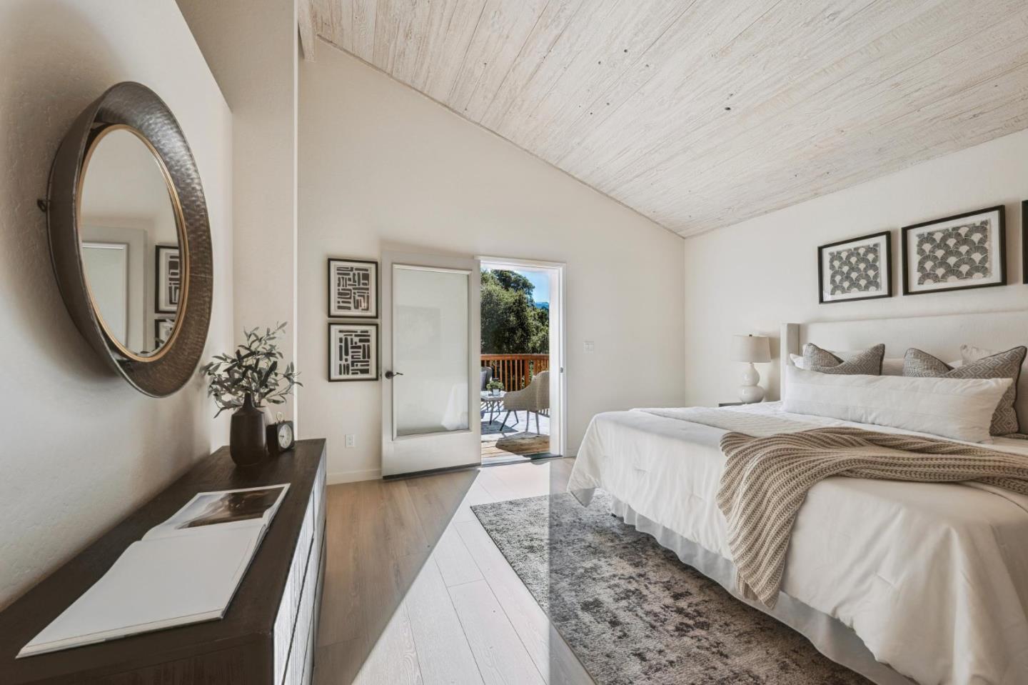 1100 Castro Road Monterey, CA 93940 - Photo 23 of 70 a bedroom with a bed a mirror and windows