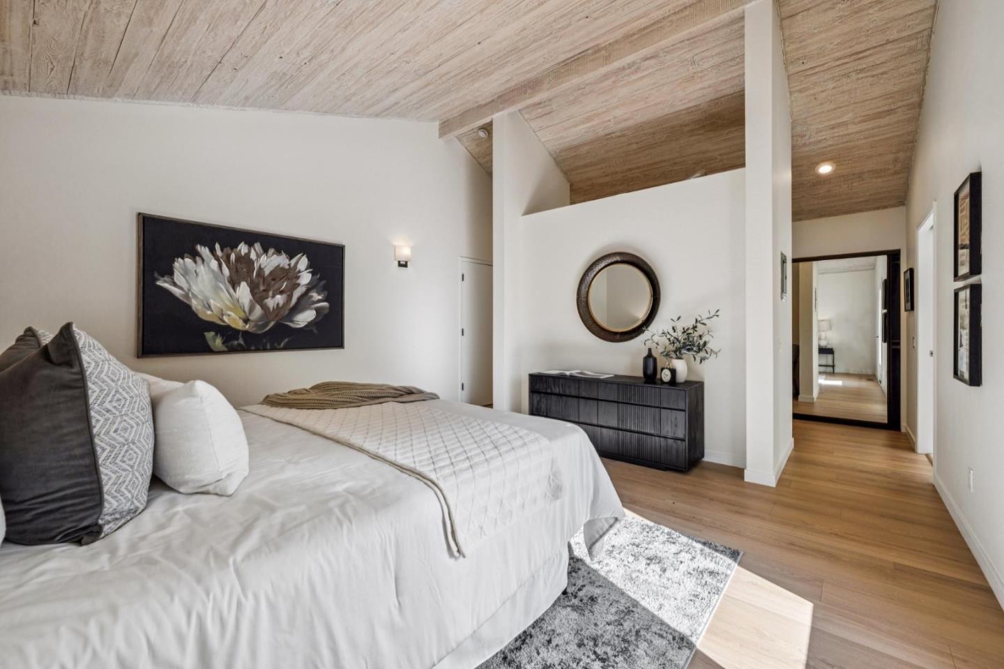 1100 Castro Road Monterey, CA 93940 - Photo 25 of 70 a bedroom with a bed and a chandelier