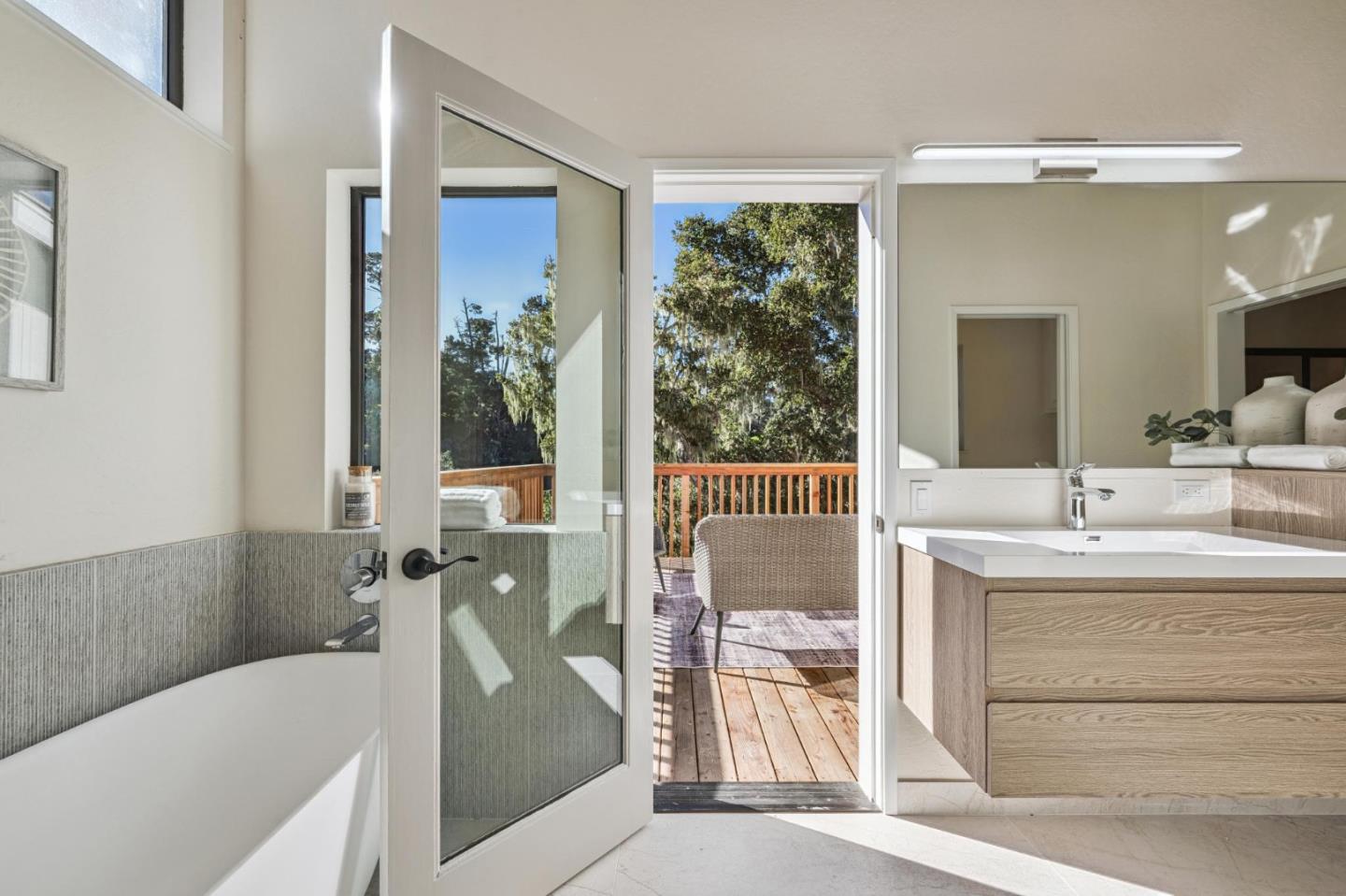 1100 Castro Road Monterey, CA 93940 - Photo 32 of 70 a en suite bathroom with a granite countertop tub sink and mirror