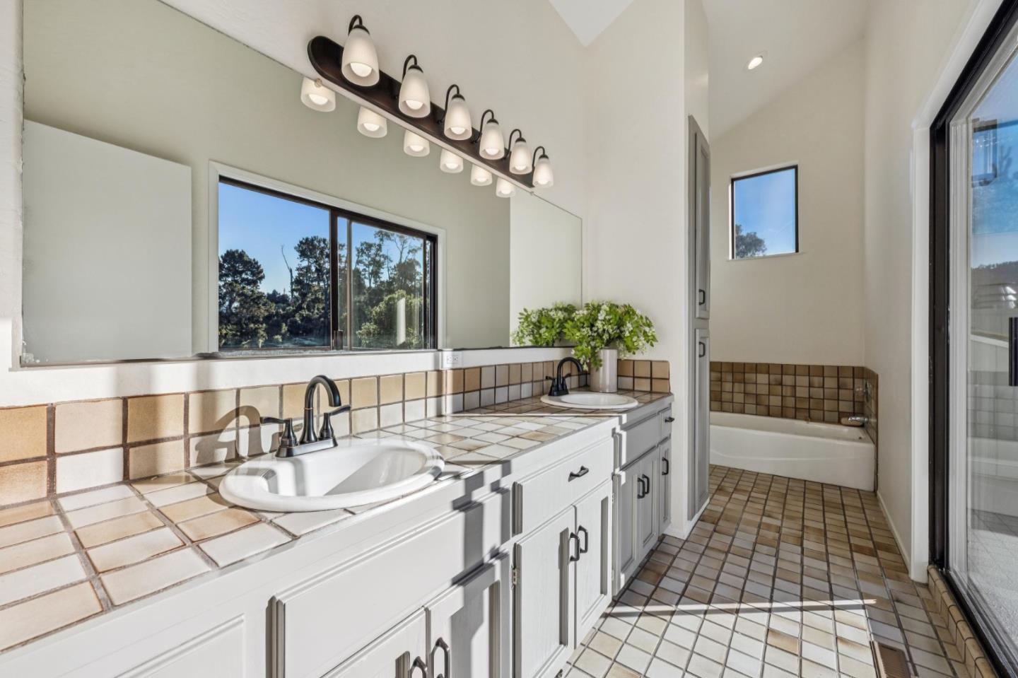 1100 Castro Road Monterey, CA 93940 - Photo 46 of 70 a bathroom with a sink a vanity and a mirror