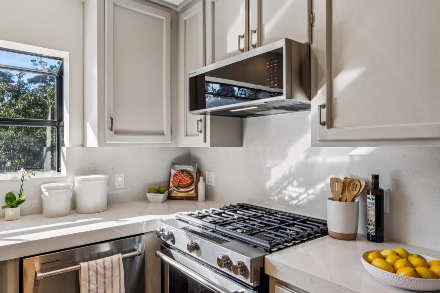 1100 Castro Road Monterey, CA 93940 - Photo 10 of 70 a kitchen with a stove and a microwave