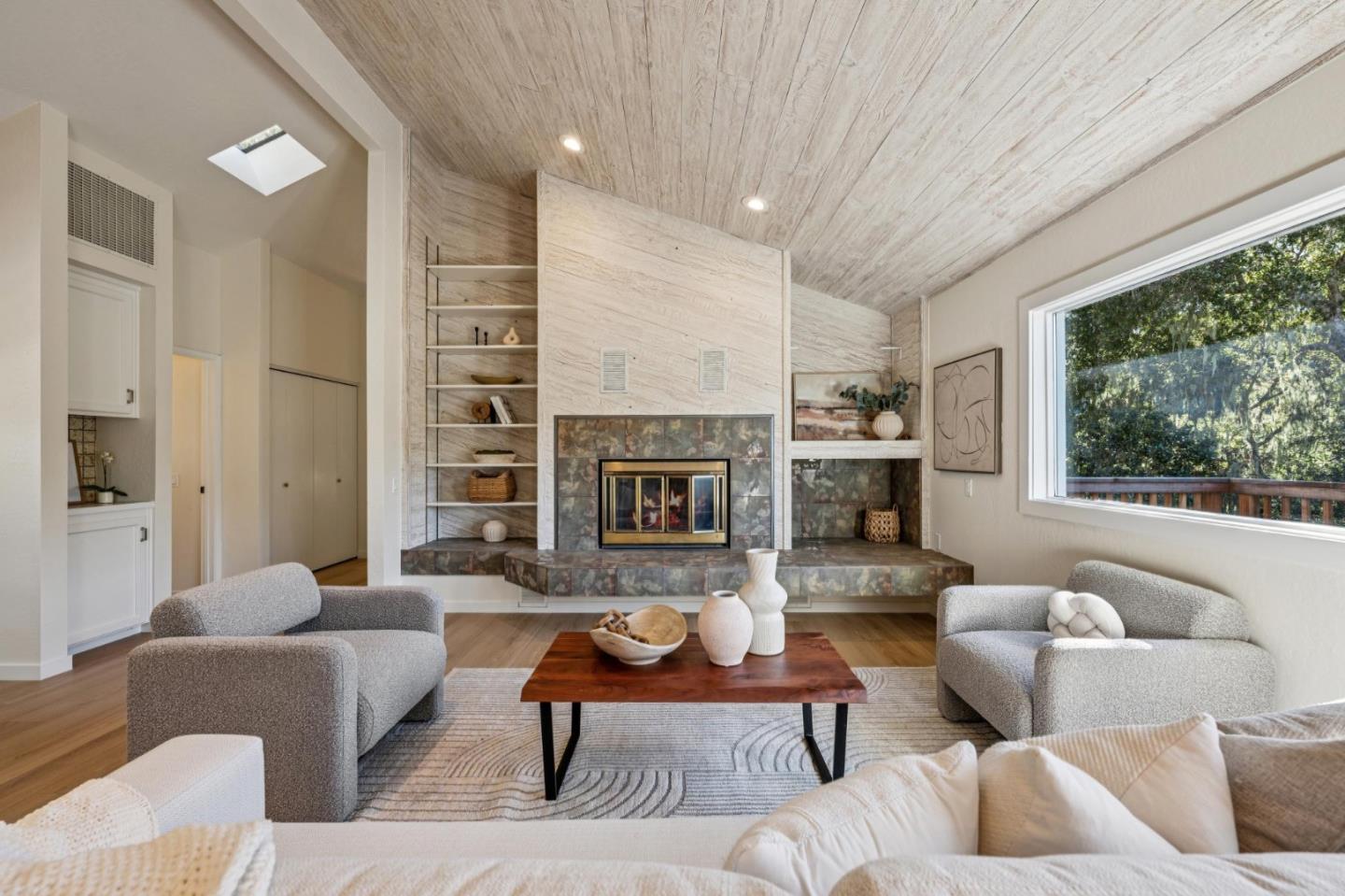 1100 Castro Road Monterey, CA 93940 - Photo 10 of 70 a living room with furniture kitchen view and a fireplace