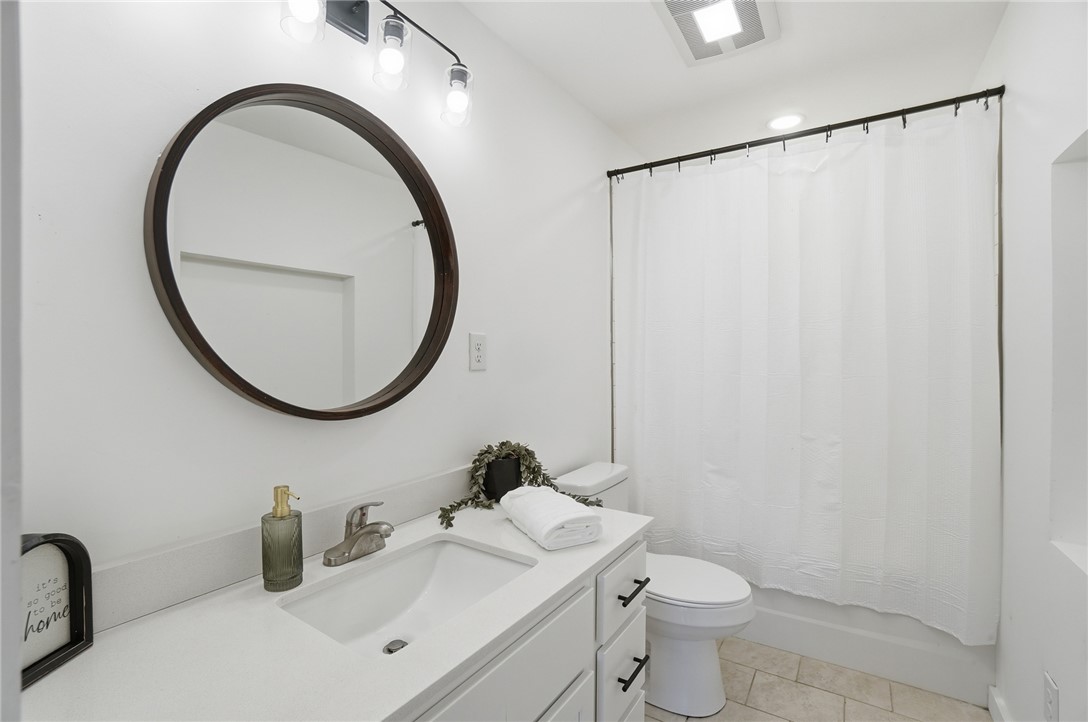 3991 Benner Road Miamisburg, OH 45342 - Photo 27 of 44 This bright bathroom features a modern vanity with ample counter space and stylish fixtures.