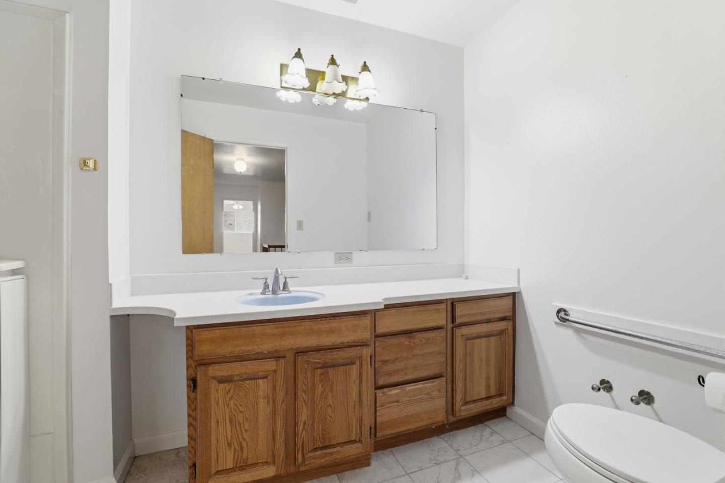 208 Mill Creek Road Fremont, CA 94539 - Photo 28 of 59 a bathroom with a double vanity sink and a mirror