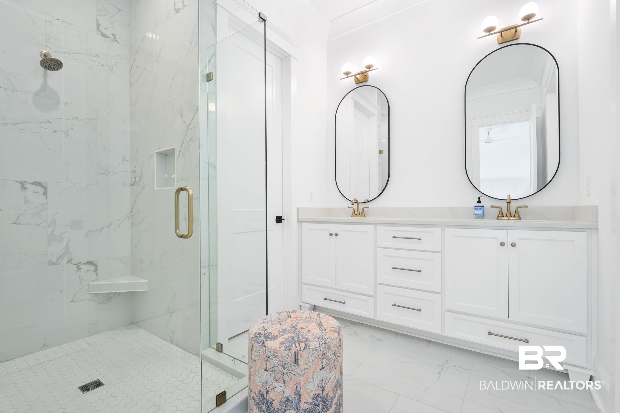 30313 River Road Orange Beach, AL 36561 - Photo 35 of 50 Full bath with light marble finish floors, double vanity, and a marble finish shower