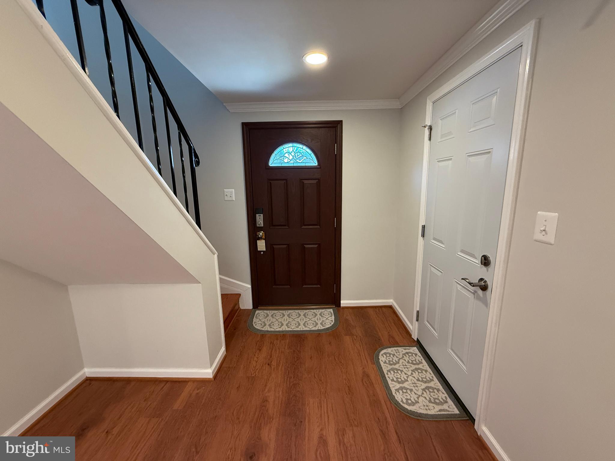 4721 Springbrook Drive Annandale, VA 22003 - Photo 15 of 69 a view of a hallway with wooden floor and staircase
