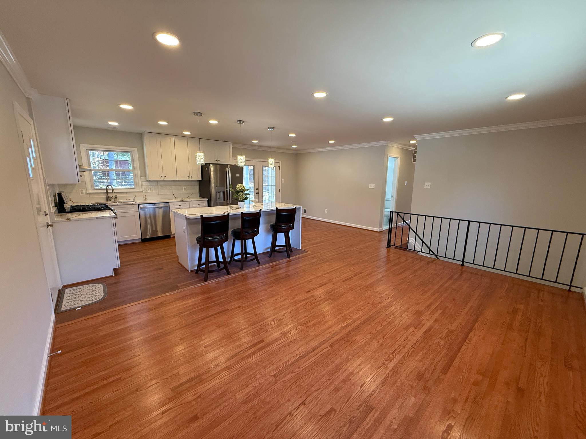 4721 Springbrook Drive Annandale, VA 22003 - Photo 23 of 69 a living room with stainless steel appliances dining table wooden floor and a kitchen view