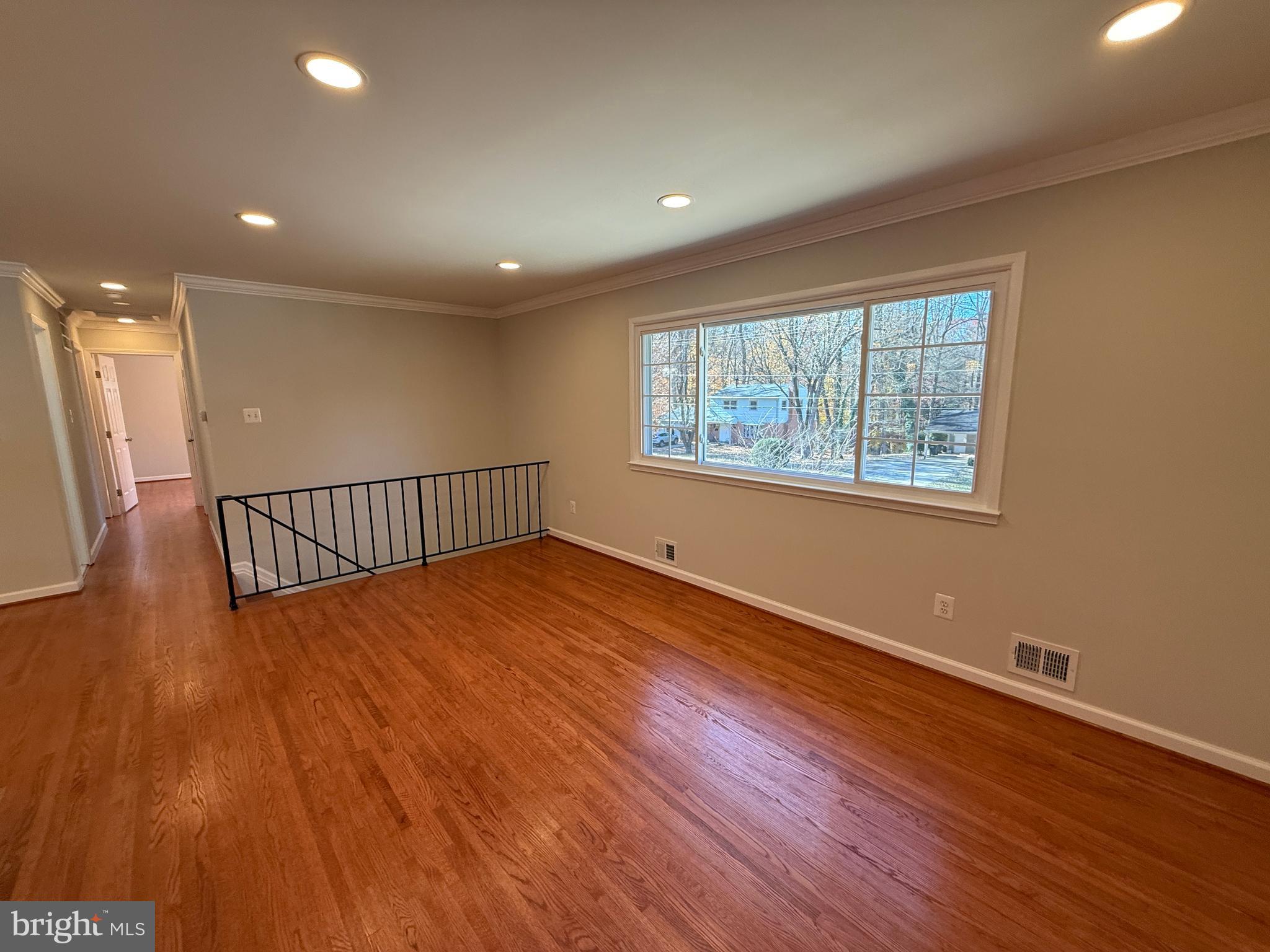 4721 Springbrook Drive Annandale, VA 22003 - Photo 31 of 69 a view of an empty room with wooden floor and windows