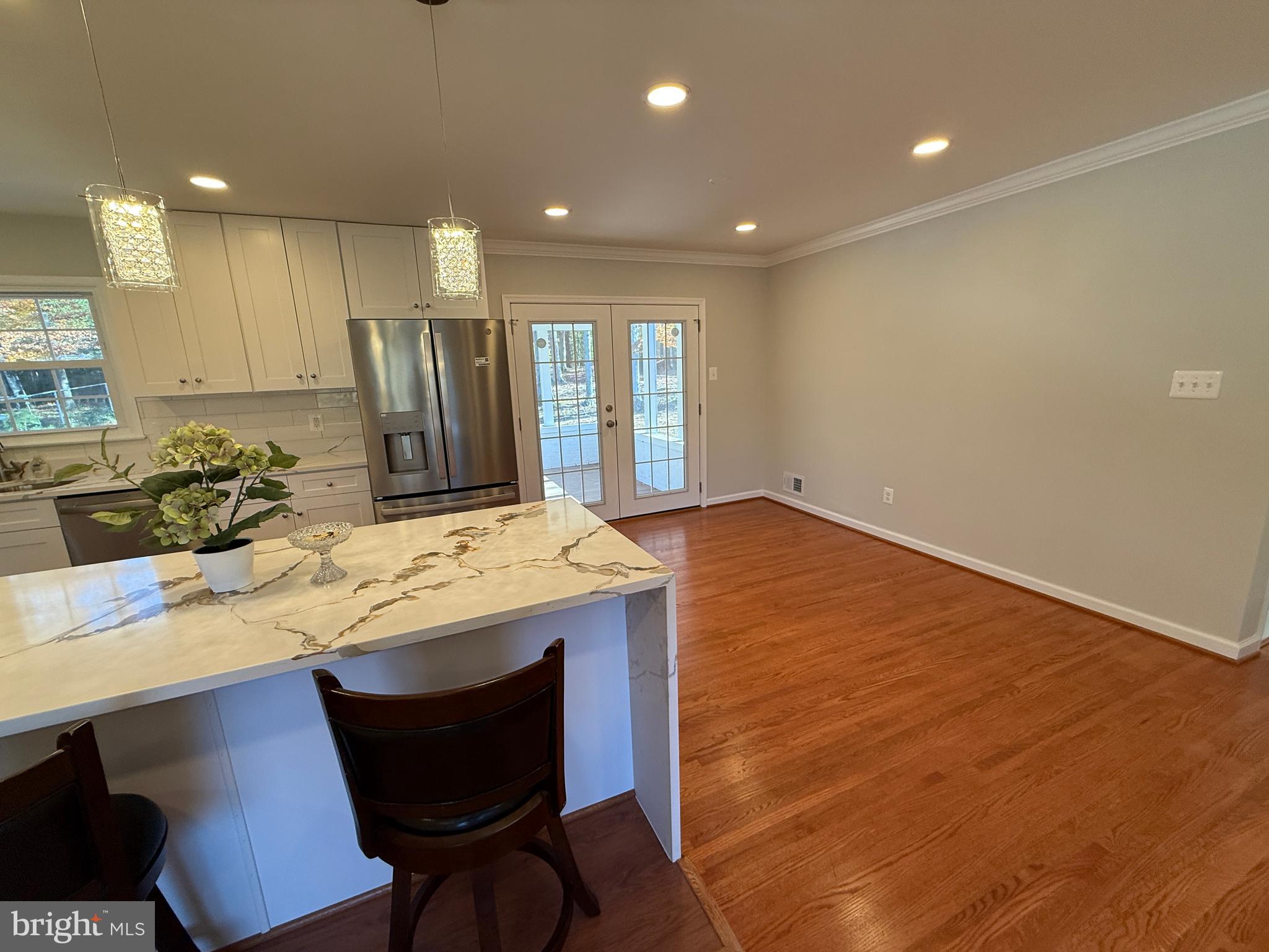 4721 Springbrook Drive Annandale, VA 22003 - Photo 33 of 69 a kitchen with kitchen island a stove a sink and a refrigerator