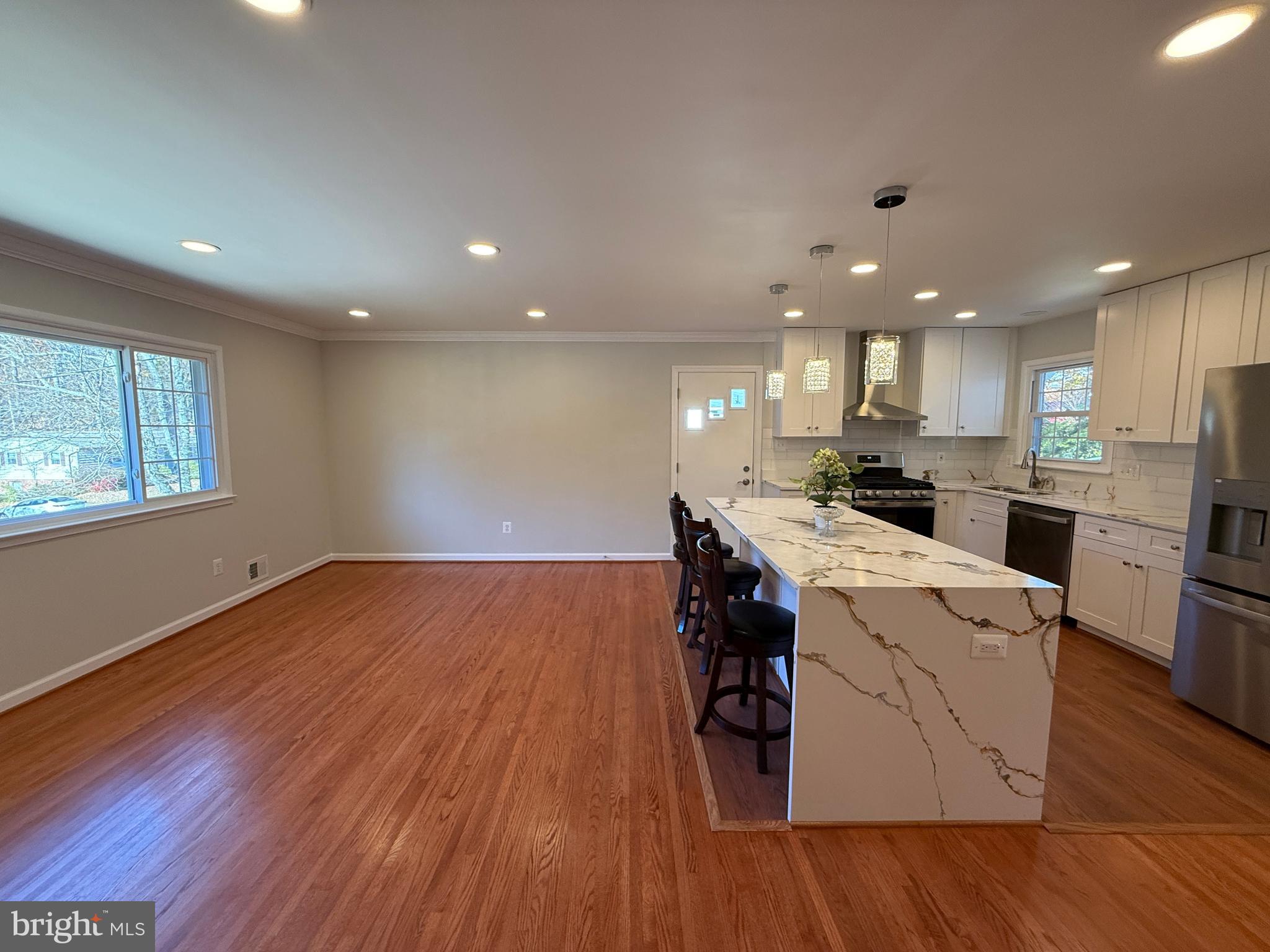 4721 Springbrook Drive Annandale, VA 22003 - Photo 34 of 69 a kitchen with a sink wooden floor and stainless steel appliances