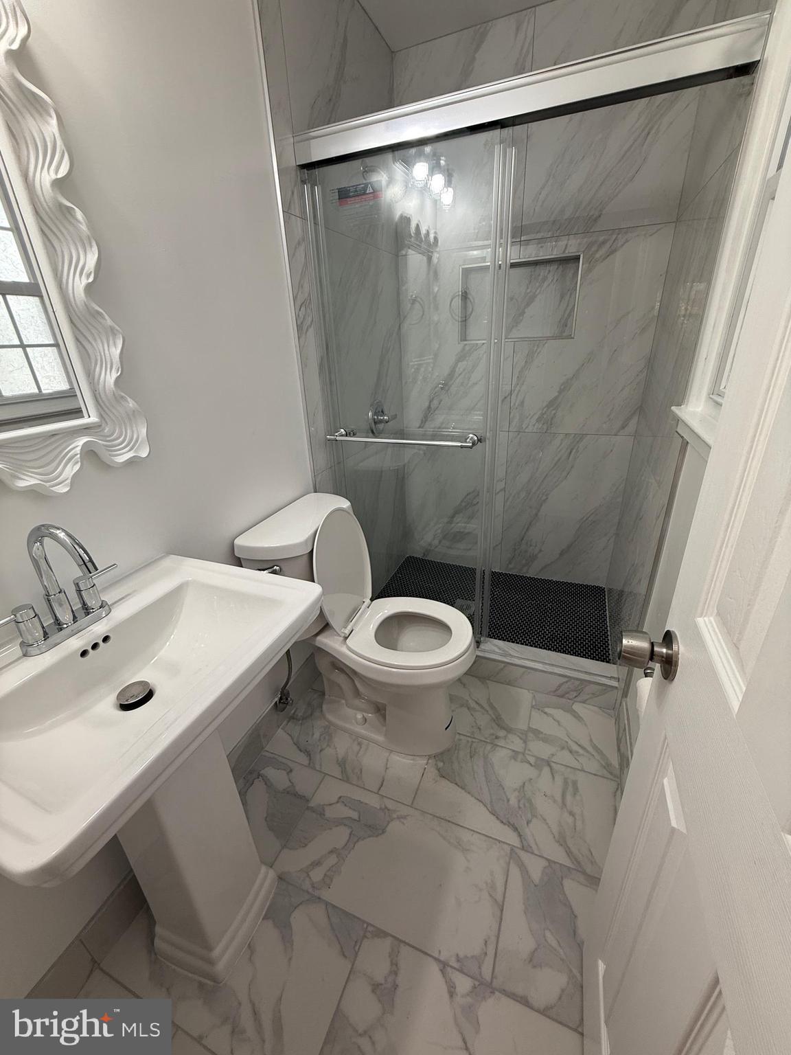 4721 Springbrook Drive Annandale, VA 22003 - Photo 38 of 69 a bathroom with a sink a toilet and shower