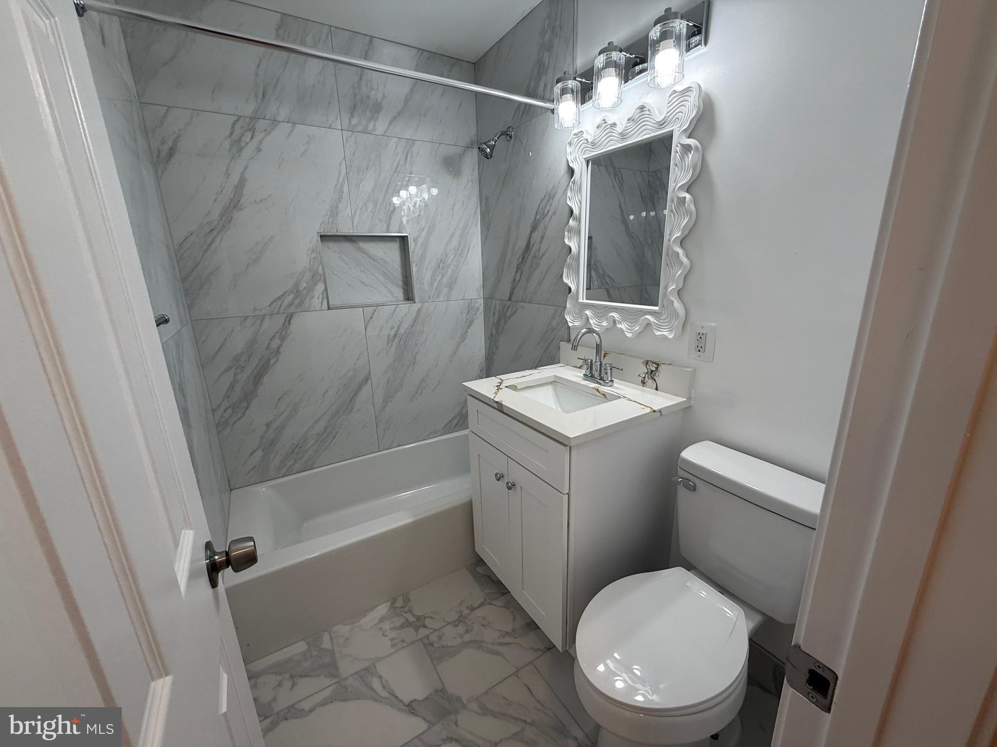 4721 Springbrook Drive Annandale, VA 22003 - Photo 43 of 69 a bathroom with a toilet a sink and shower