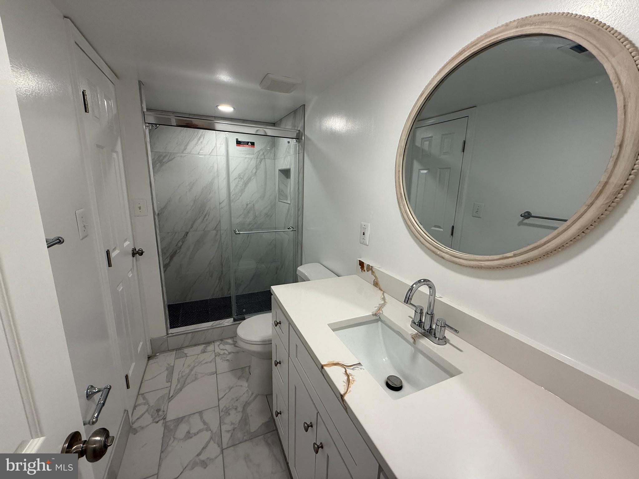 4721 Springbrook Drive Annandale, VA 22003 - Photo 47 of 69 a spacious bathroom with a sink a toilet and a mirror